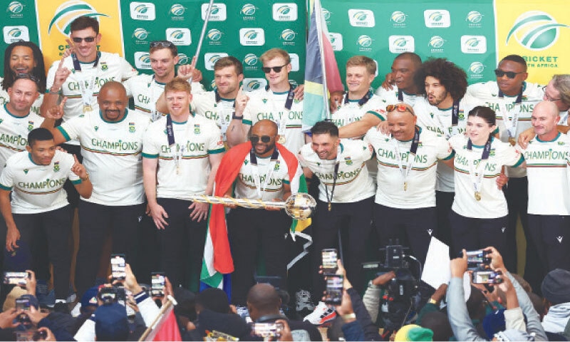 South African captain Temba Bavuma holds the World Test Championship Mace in celebration with team-mates at the 
O.R. Tambo International Airport on Wednesday.&mdash;Reuters