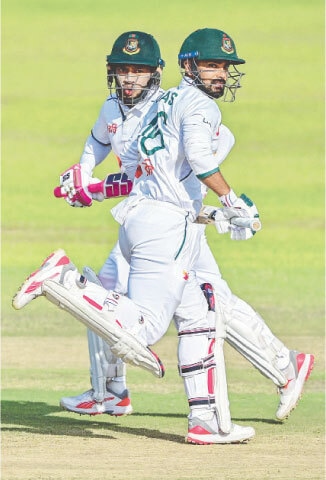 BANGLADESH batters Mushfiqur Rahim (L) and Liton Das run between the wickets during the first Test against Sri Lanka at the Galle International Cricket Stadium on Wednesday.—AFP