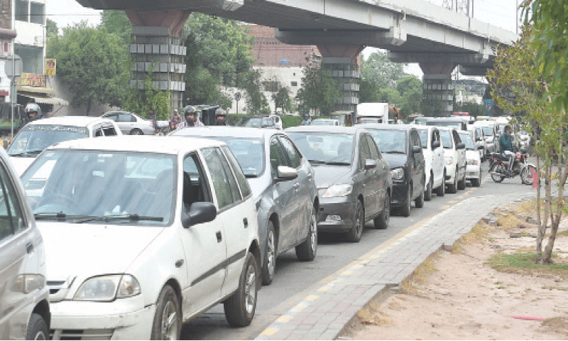 Motorists wait for their turn to get their vehicles checked outside the Ferozepur Road ETS centre. — White Star
