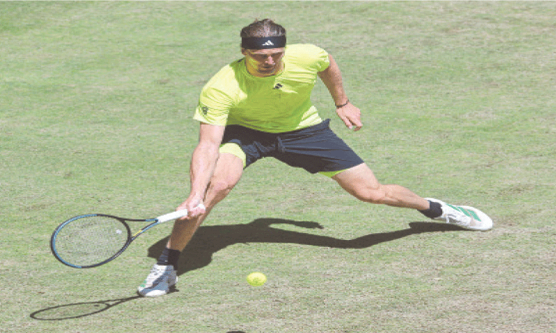 GERMANY’S Alexander Zverev returns a shot to Flavio Cobolli of Italy during their Halle Open match on Friday.—AFP