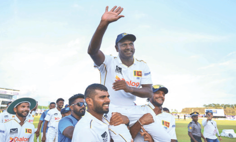 GALLE: Sri Lanka&rsquo;s Angelo Mathews gestures as he is carried around the field by team-mates at the end of the first Test against Bangladesh at the Galle International Cricket Stadium on Saturday. Mathews, who made his debut in 2009 on the famous pitch perched beneath the fortress in Galle in 2009, will hang up his boots with over 8,000 runs, after playing his 119th and final Test, behind only Kumar Sangakkara and Mahela Jayawardene in Sri Lanka&rsquo;s all-time charts.&mdash;AFP