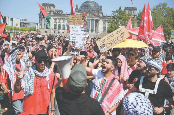  PROTESTERS attend ‘United 4 Gaza!’ rally in front of the lower house of parliament in Berlin on Saturday.—AFP 