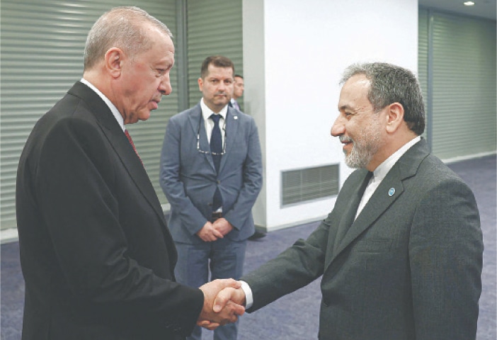 President Recep Tayyip Erdogan of Turkiye (left) shakes hands with Iran’s Foreign Minister Abbas Araghchi ahead of a session of the Organisation of Islamic Cooperation in Istanbul on Saturday.—AFP
