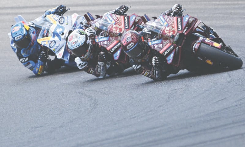 DUCATI Lenovo Team’s Spanish rider Marc Marquez steers his motorbike ahead of Italian team-mate Francesco Bagnaia (C) and BK8 Gresini Racing’s Alex Marquez of Spain during the Italian MotoGP Grand Prix at Mugello Circuit on Sunday.—AFP