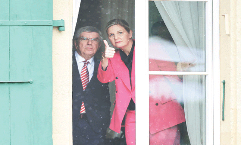 NEW International Olympic Committee president Kirsty Coventry gives a thumbs up alongside her predecessor Thomas Bach before the handover ceremony at the IOC headquarters on Monday.—Reuters NEW International Olympic Committee president Kirsty Coventry gives a thumbs up alongside her predecessor Thomas Bach before the handover ceremony at the IOC headquarters on Monday.—Reuters