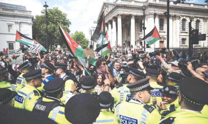 LONDON: Protesters and police clash during a rally in support of Palestine Action, a rights body, at Trafalgar Square after the British government announced a ban on the group after its activists broke into the UK’s largest air force base last week.—AFP