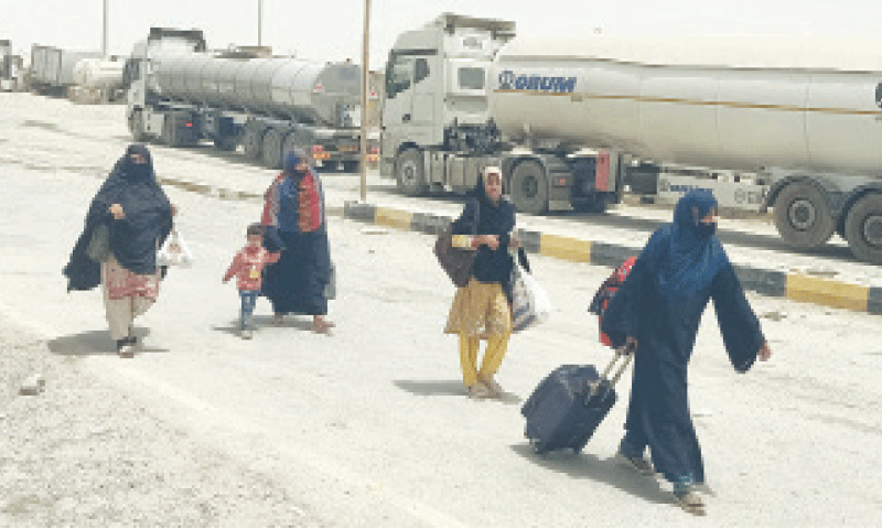 GWADAR: Pilgrims cross the border from Iran.—Photo by the writer