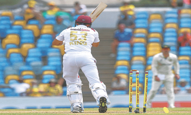 WEST INDIES batter Brandon King is cleaned up by Australian pacer Josh Hazlewood during the first Test at the Kensington Oval on Thursday.—AFP WEST INDIES batter Brandon King is cleaned up by Australian pacer Josh Hazlewood during the first Test at the Kensington Oval on Thursday.—AFP