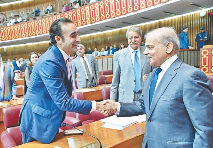 ISLAMABAD: Prime Minister Shehbaz Sharif greets PPP Chairman Bilawal Bhutto-Zardari in the National Assembly during the final budget session.—APP