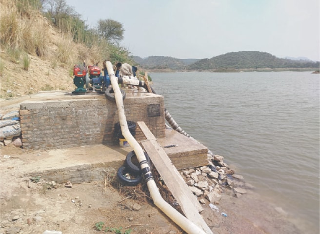 Water being pumped to tanks through engines from Khai Dam. &mdash; Dawn