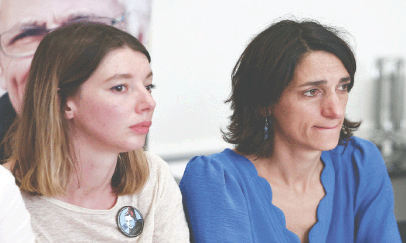 ANNE Laure Paris (right), daughter of Jacques Paris, and Noemie Kohler, Cecile Kohler’s daughter, speak during a press conference with their lawyers in Paris on Friday.—AFP