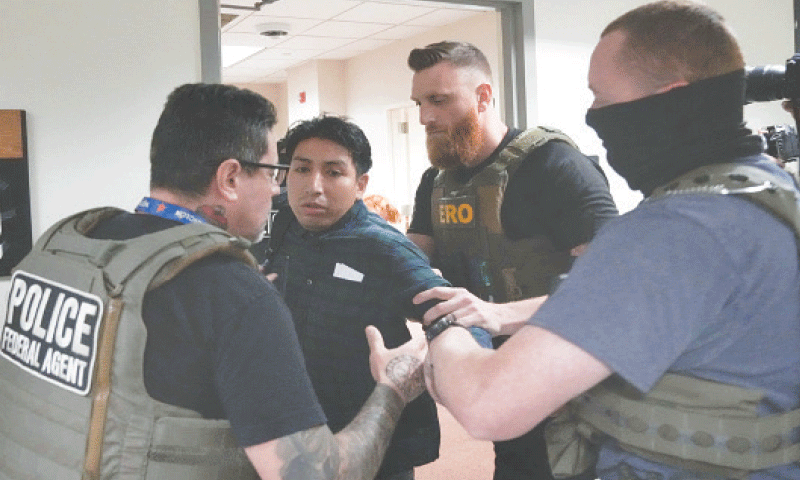 An immigrant is detained by ICE agents inside the New York Federal Plaza courthouse following legal proceedings.&mdash;AFP