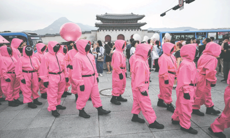 PINK Guards of Squid Game perform during a parade for Netflix&rsquo;s South Korean TV series Squid Game Season 3 at Seoul&rsquo;s Gwanghwamun Square on Saturday.&mdash;AFP