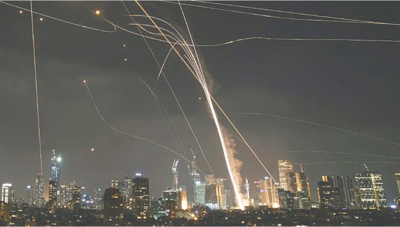  A projectile hits buildings in Tel Aviv as the Israeli Iron Dome air defence system fires to intercept Iranian missiles on June 13, 2025: in the immediate context, Iran’s central objective was and remains to find reprieve | AP 