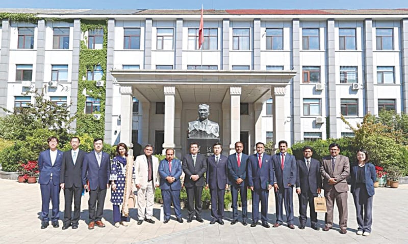The delegation of scholars from Sindh, Pakistan, led by the writer (seventh 
from left) with Dr Wang Fang (eighth from left), the president of the China Foreign Affairs University in Beijing, and Chinese scholars outside the 
university building | Photo courtesy the writer