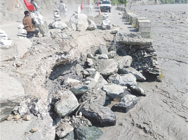 A view of the Airport Road affected by the high flood in Chitral River. &mdash; Dawn