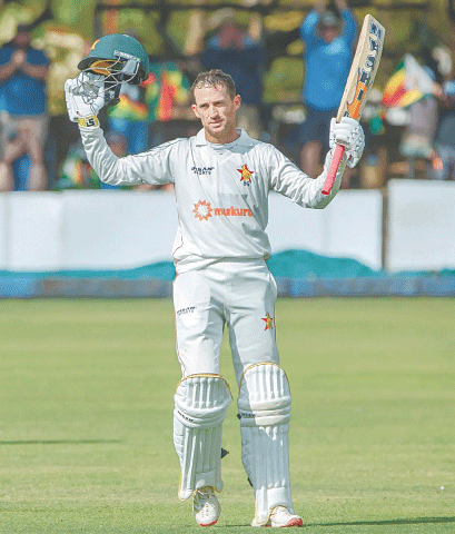 Zimbabwean batter Sean Williams celebrates scoring a century during the first Test against South Africa at the Queen’s Sports Club on Sunday.—courtesy ZC
