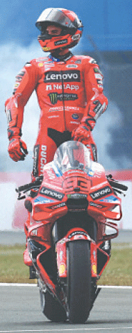 ASSEN: Ducati Lenovo Team&rsquo;s Marc Marquez celebrates after winning the MotoGP Grand Prix of Netherlands at the TT Circuit on Sunday.&mdash;Reuters