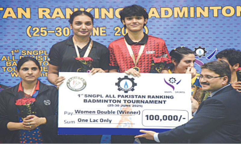 WOMEN’S doubles winners of the All-Pakistan Ranking Badminton Tournament Ghazala Siddique (L) and Ammarah Ishtiaq pose during the prize distribution ceremony at the POF Wah Complex.—Dawn