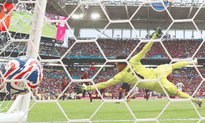 Bayern Munich’s Harry Kane (obscured) scores past Flamengo goalkeeper Agustin Rossi during their Club World Cup round-of-16 match at the Hard Rock Stadium.—AFP