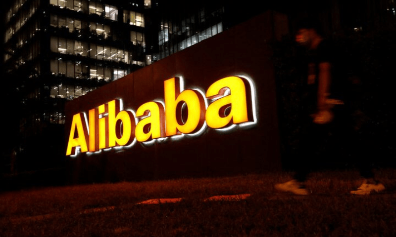 A man walks past a logo of Alibaba Group at its office building in Beijing, China, on August 9, 2021. — Reuters/File Photo