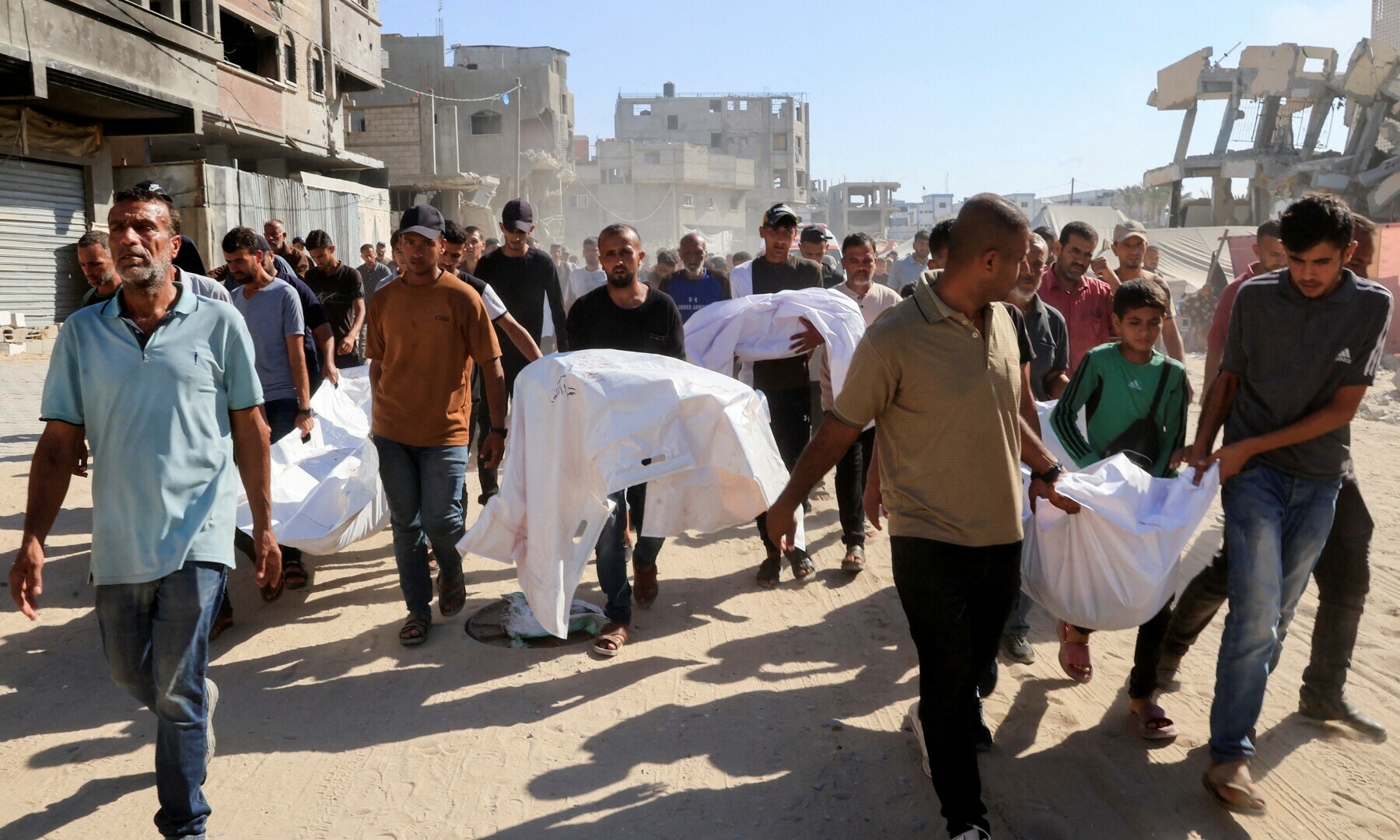 Mourners carry the bodies of Palestinians were killed in an overnight Israeli strike on a tent, outside Nasser Hospital in Khan Younis, southern Gaza Strip on July 3, 2025. — Reuters/Hatem Khaled