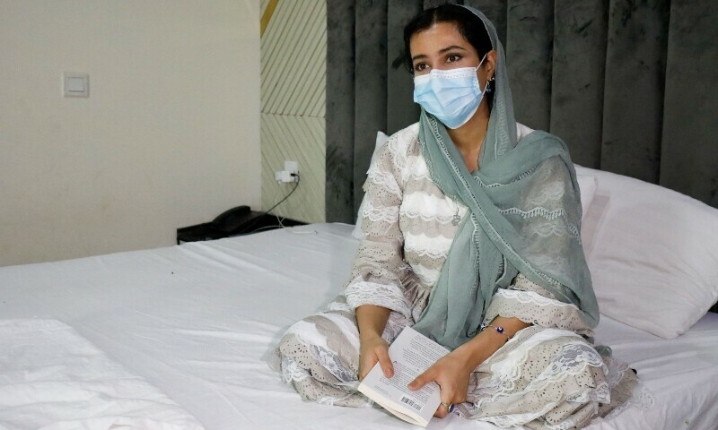 Kimia, 25, an Afghan journalist and artist who was accepted into Germany’s humanitarian admission programme for vulnerable Afghans, now stranded in legal limbo, speaks with Reuters at a guest house where she is living, in Islamabad, June 13. — Reuters
