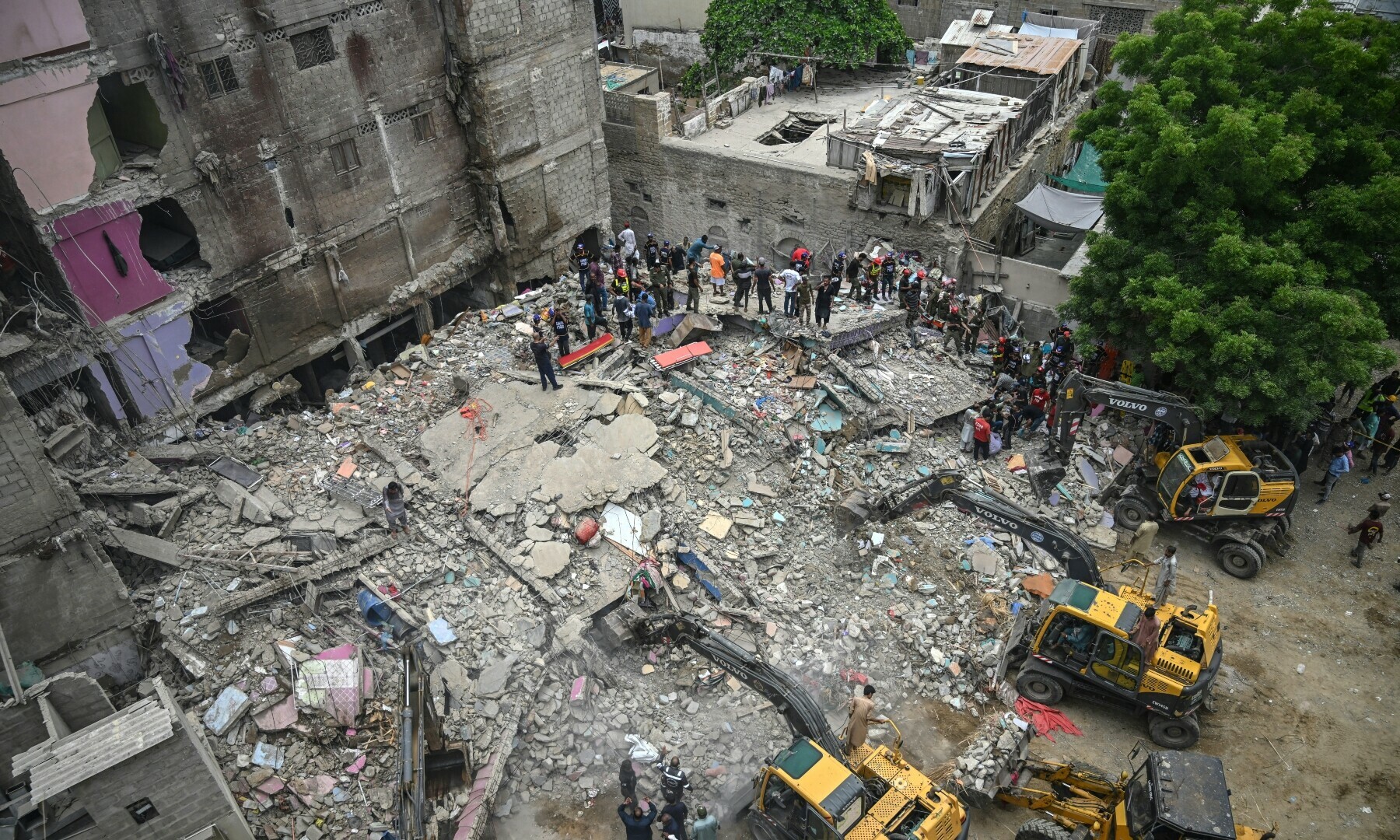 A rescue operation is underway at the site where a residential building collapsed in Karachi on July 4, 2025. — AFP