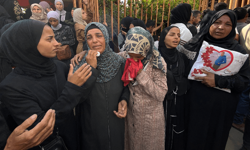 Mourners weep during the funeral of Palestinians killed in Israeli strikes on the southern Gaza Strip the previous day, outside the Nasser Hospital in Khan Younis on July 4, 2025. — AFP