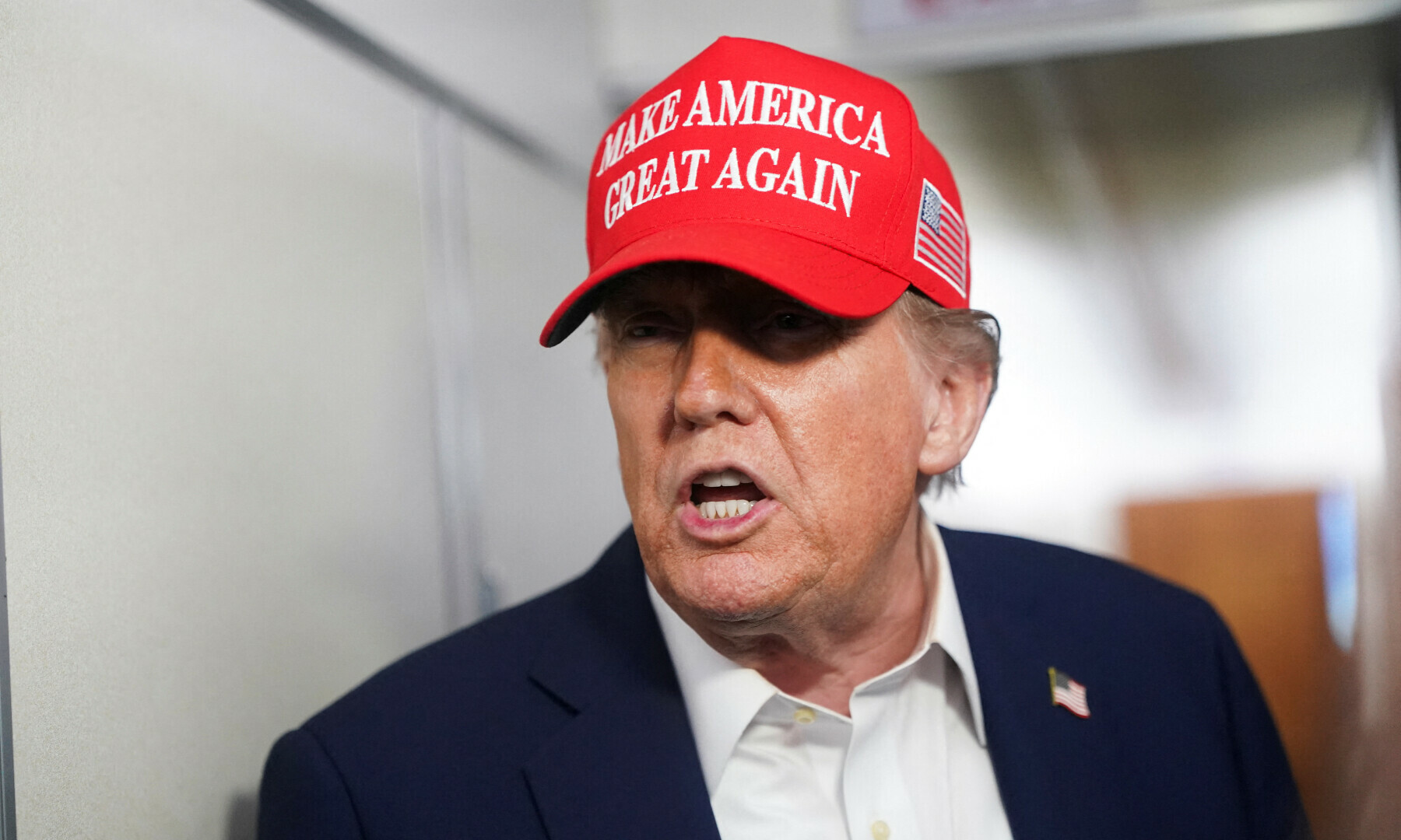US President Donald Trump speaks to members of the media on board Air Force One on the way to New Jersey, US on July 4, 2025. — Reuters/Nathan Howard