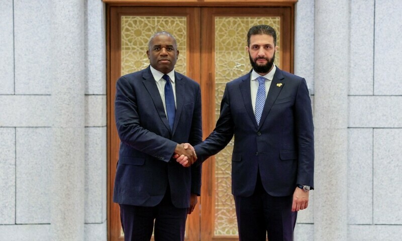 Syria’s interim President Ahmad Al-Sharaa (R) welcoming British Foreign Secretary David Lammy in Damascus, Syria, July 5. — AFP