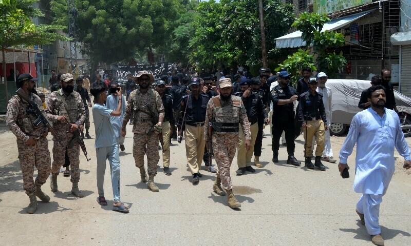 Police and security forces perform duties during  a Muharram 9 procession, Hyderabad, July 5. — Photo by Umair Ali