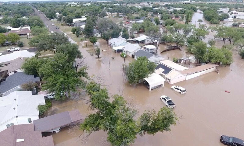 A drone view shows flooded houses, following torrential rains that unleashed flash floods along the Guadalupe River in San Angelo, Texas, the US on July 4. — Reuters