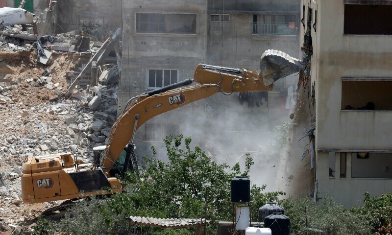Israeli army bulldozers plough through homes at West Bank camps