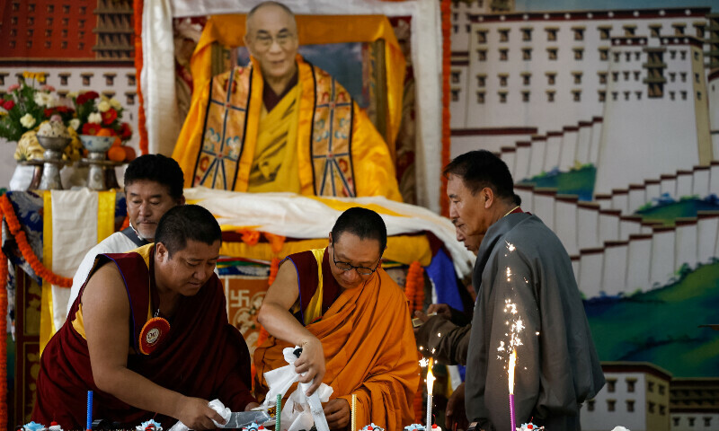 Tibetan monks cut cakes during an event organised to mark the 90th birthday celebration of their spiritual leader, the Dalai Lama, at Jawalakhel Handicraft Center, also known as Tibetan Refugee Camp, Lalitpur, Nepal, July 6. —AFP