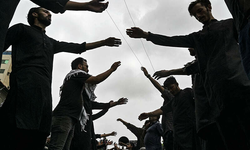 Mourners take part in a Muharram procession in Karachi on July 6. — AFP