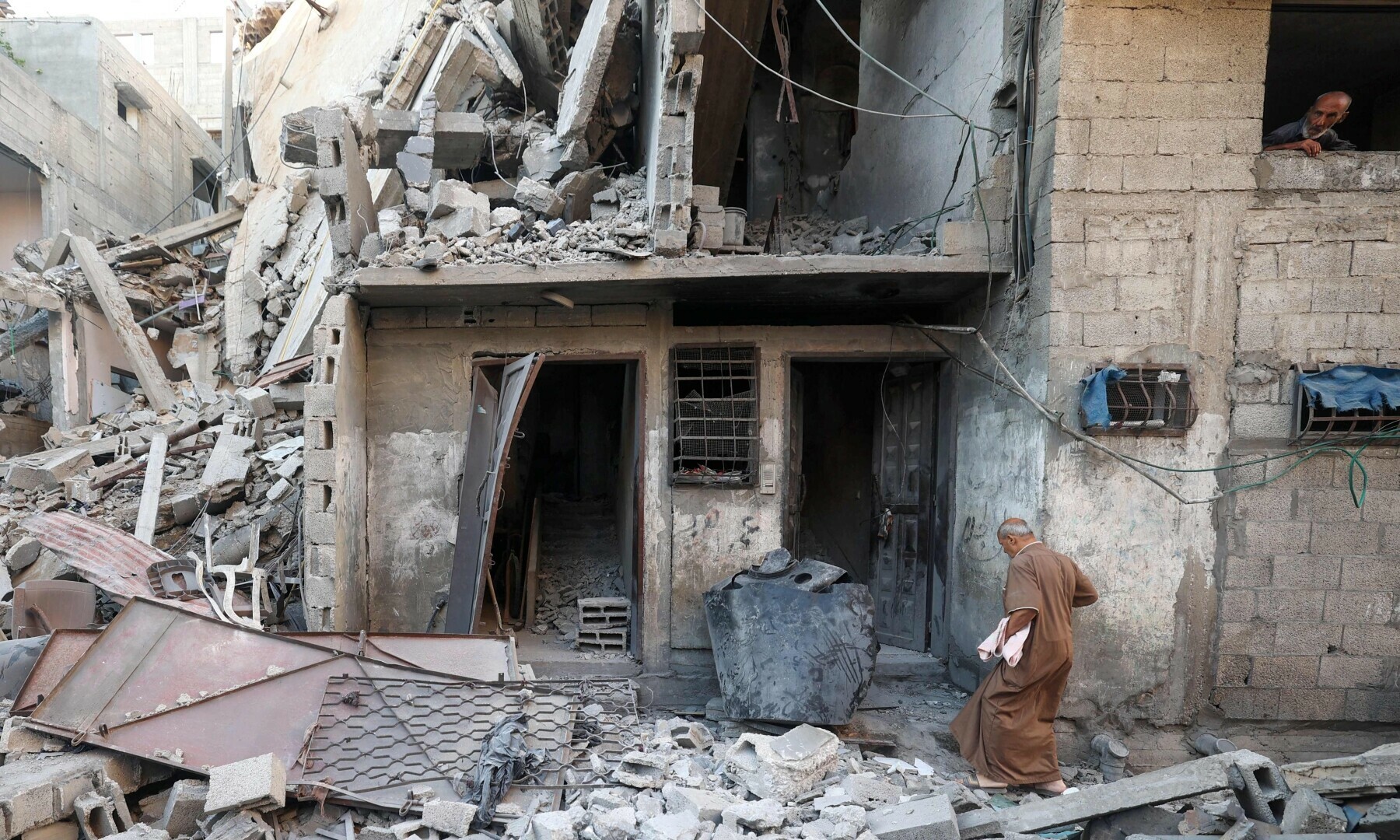 Palestinians inspect the damage to their homes in the Al-Bureij camp in the central Gaza Strip on July 7, 2025. — AFP