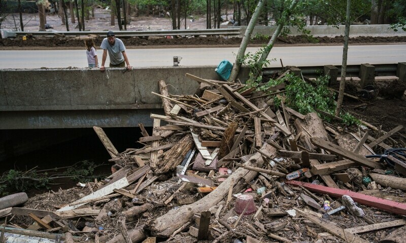 A man looks at the debris along the Rio Ruidoso after deadly flash flooding in Ruidoso, New Mexico, US July 9. — Reuters A man looks at the debris along the Rio Ruidoso after deadly flash flooding in Ruidoso, New Mexico, US July 9. — Reuters