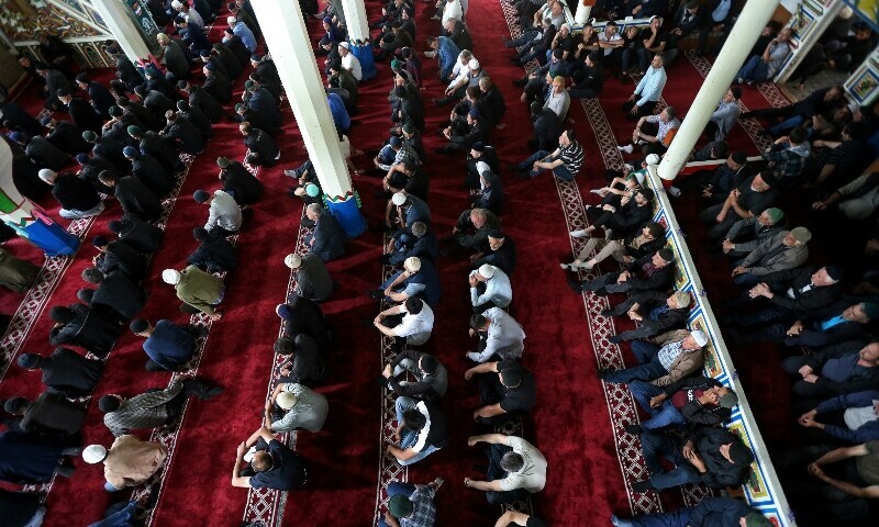 Worshipers attend a mass prayer on the first day of Kurban Bayram, also known as Eidul Azha, in a wooden mosque in the village of Ghorjomi, Georgia, June 6.  — Reuters 