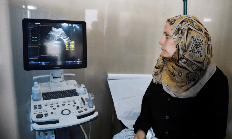Fatima Arafa, a pregnant and displaced Palestinian woman, has a consultation with a doctor at Al-Helou hospital in Gaza City, July 10. — Reuters