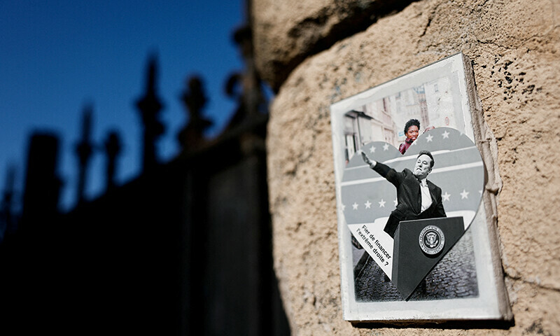 A sticker in opposition to Tesla CEO Elon Musk is affixed on a wall in Paris, France, March 17. — Reuters