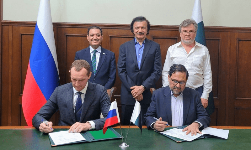 Vadim Velichko, general director of Industrial Engineering LLC, and Saif Anjum, secretary of industries and production, sign a protocol to restore and modernise Pakistan Steel Mills.—APP