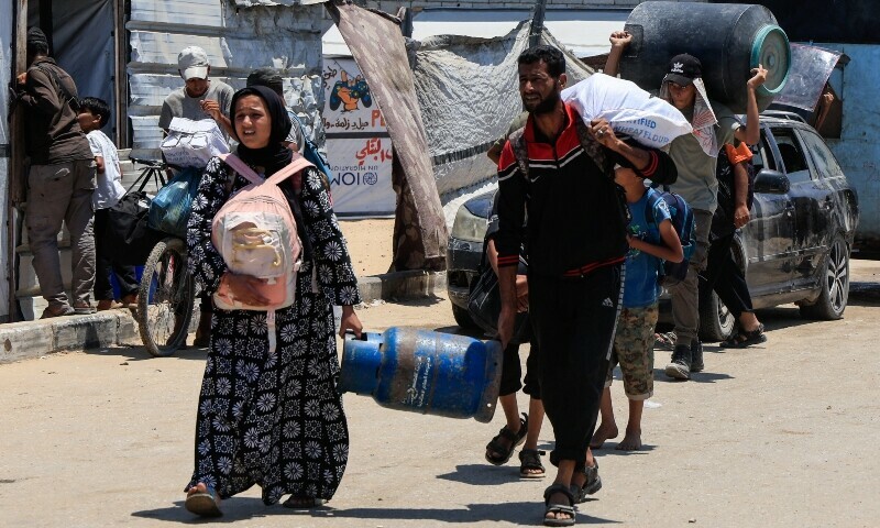 Displaced Palestinians make their way towards Mawasi area as they flee amid an Israeli ground offensive, in Khan Younis in the southern Gaza Strip, July 10. — Reuters