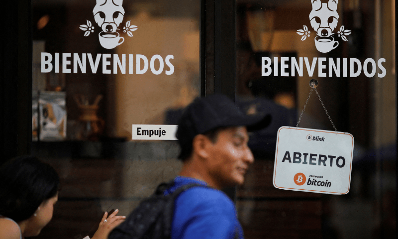 People walk into a coffee shop that accepts Bitcoin, after it soared above $118,000, in San Salvador, El Salvador, on July 11, 2025. — Reuters