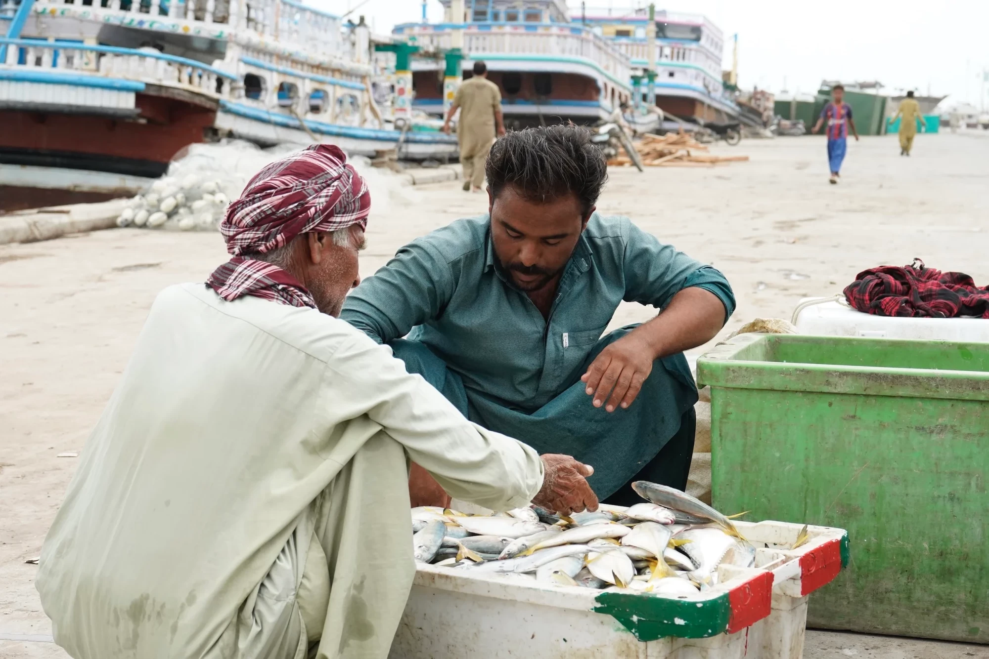 At Gwadar port in Balochistan, local people buy fresh catches directly from fishers. With collapsed exports and rising fuel costs, prices are falling and profits for fishers are thinning (Image: Abdul Rahim)