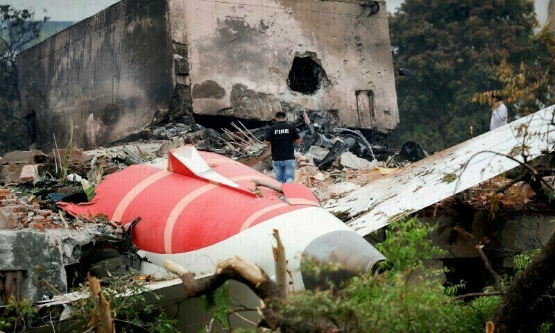 A firefighter stands next to the crashed Air India Boeing 787-8 Dreamliner aircraft in Ahmedabad, India on June 13. — Reuters/File
