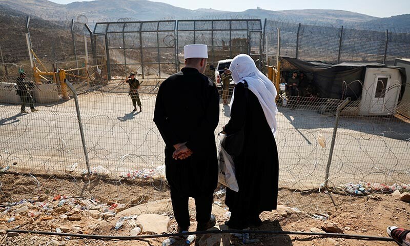 People gather, near the ceasefire line between the Israeli-occupied Golan Heights and Syria, amid the ongoing conflict in the Druze areas in Syria, in Majdal Shams on July 17, 2025. — Reuters