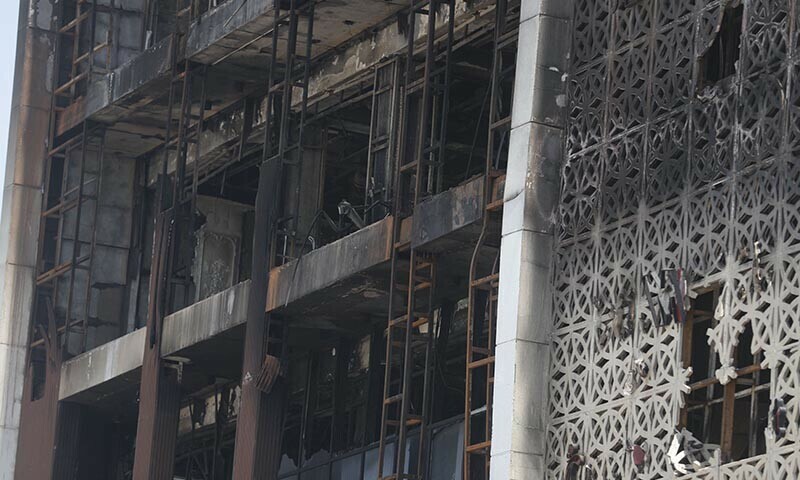 A close up shot shows on July 17, 2025 the damaged facade after a fire tore through the newly opened Hyper Mall overnight in the eastern Iraqi city of Kut, killing at least 60 people, according to Iraqi authorities. — AFP