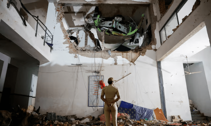 A police officer stands in front of the wreckage of an Air India aircraft, bound for London’s Gatwick Airport, which crashed during take-off from an airport in Ahmedabad, India, on June 12, 2025. — Reuters/File