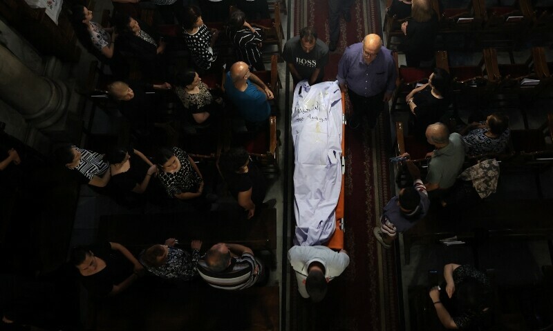 Christian Palestinian mourners attend the funeral ceremony of Saad Salameh and Foumia Ayyad, killed earlier in an Israeli strike that hit the Holy Family Church in Gaza City, at the Saint Porphyrius Church on July 17. &mdash; AFP